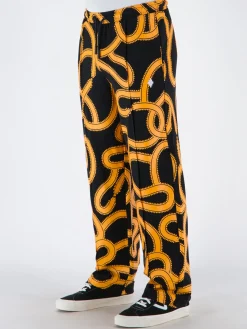 MARCELO BURLON Pantaloni<PANTALONE ALL OVER SNAKES TRACK Giallo, Nero