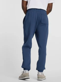 NEW BALANCE Pantaloni<PANTALONE JOGGER ATHLETICS FRENCH TERRY Blu, Nero